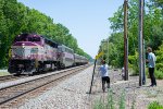 An MBTA outbound passes a gaggle of Railfans 